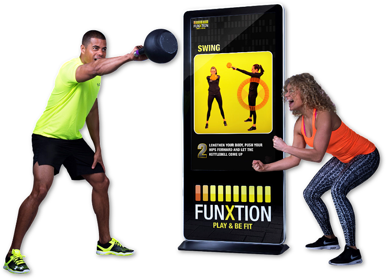Two people working out with Funxtion interactive workout screens powered by BrightSign digital signage