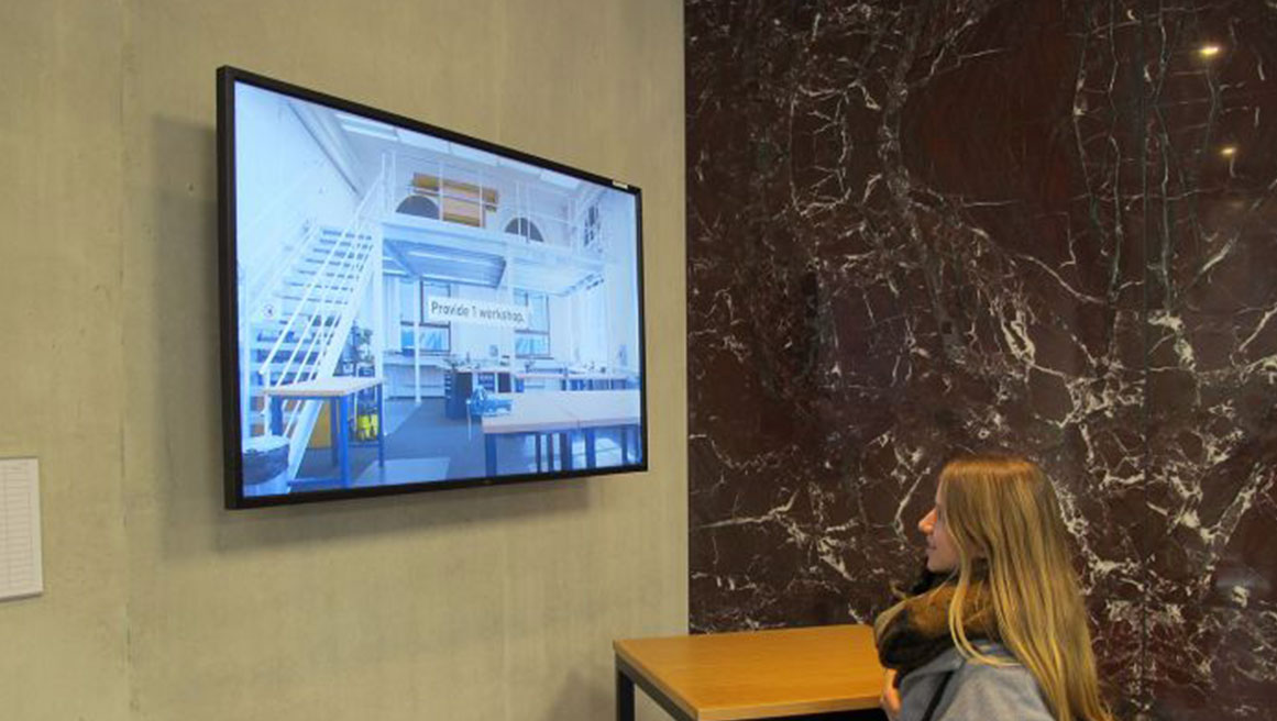 a young woman viewing digital signage display