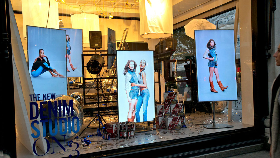 Multi-screen digital signage display at Selfridge's flagship store in London powered by BrightSign digital media players